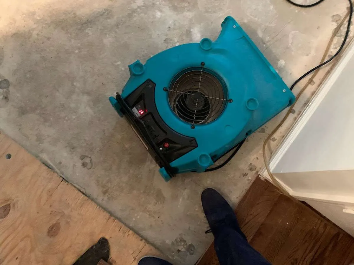 Air mover drying subfloor during Commercial Water Damage Restoration in Waikoloa Village